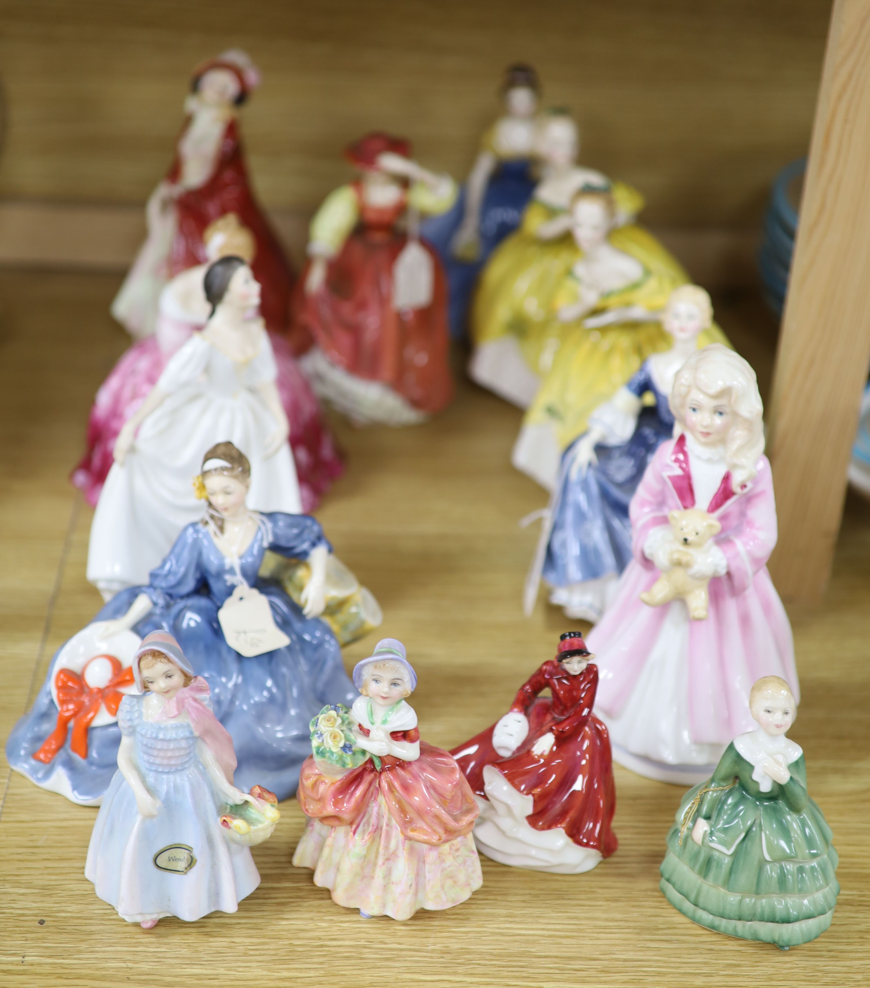 A collection of fourteen Royal Doulton figures